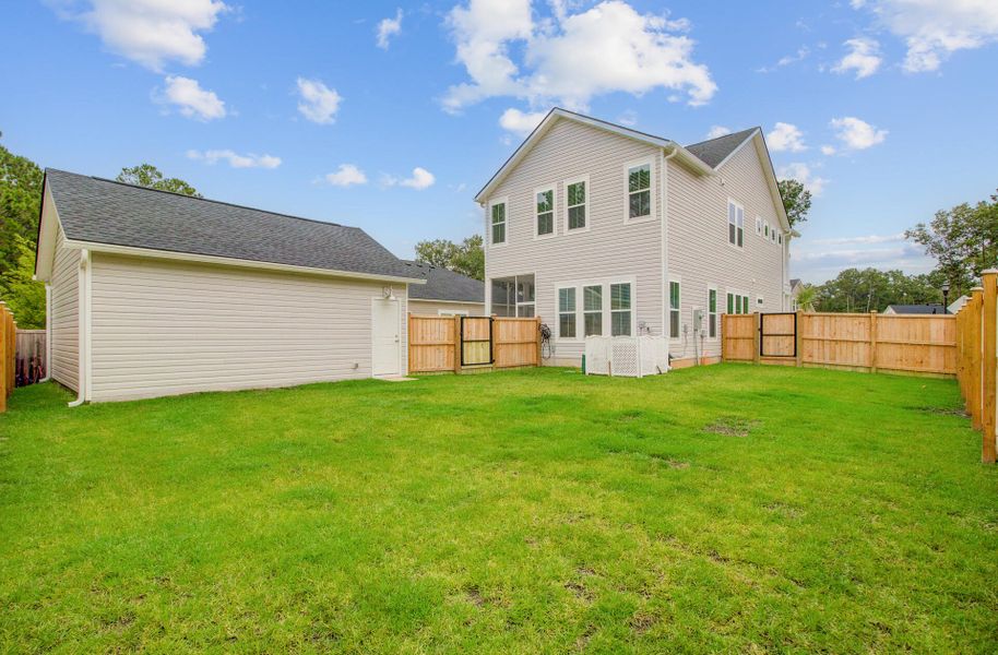 Front exterior of a new home in Limehouse Village: Row Collection, Summerville, SC, highlighting curb appeal (Image 25).