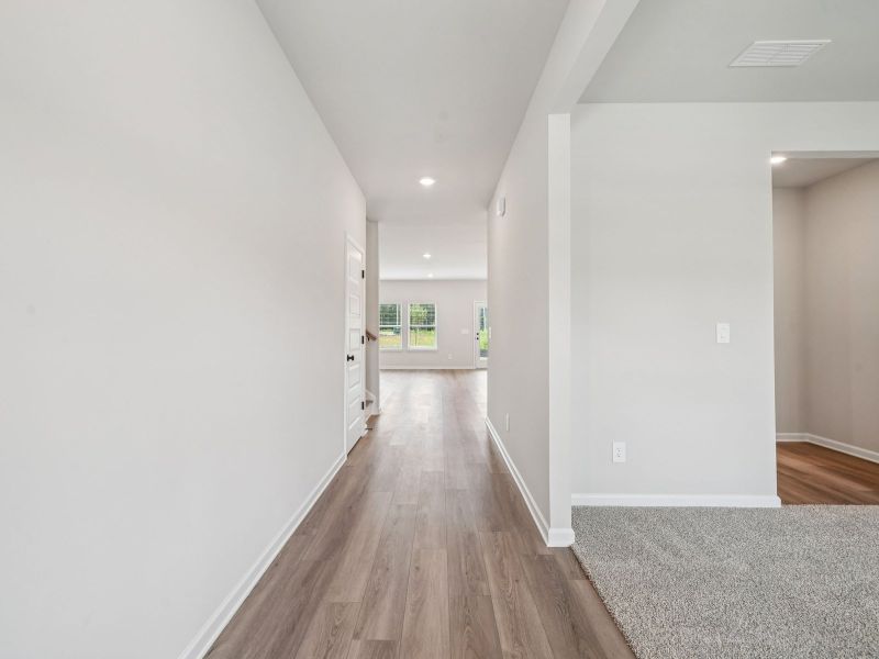 Spacious, unfurnished interior of a new home in Vines at Mill Creek - Estate Series, Braselton (Image 12).