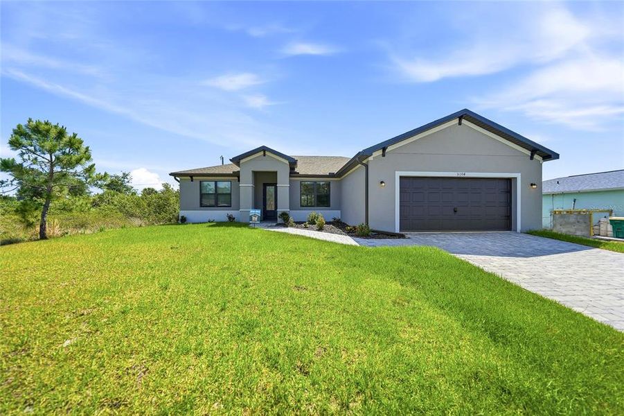 Front exterior of a new home in , Port Charlotte, FL, highlighting curb appeal (Image 32). Front exterior of a new home in , Port Charlotte, FL, highlighting curb appeal (Image 32).