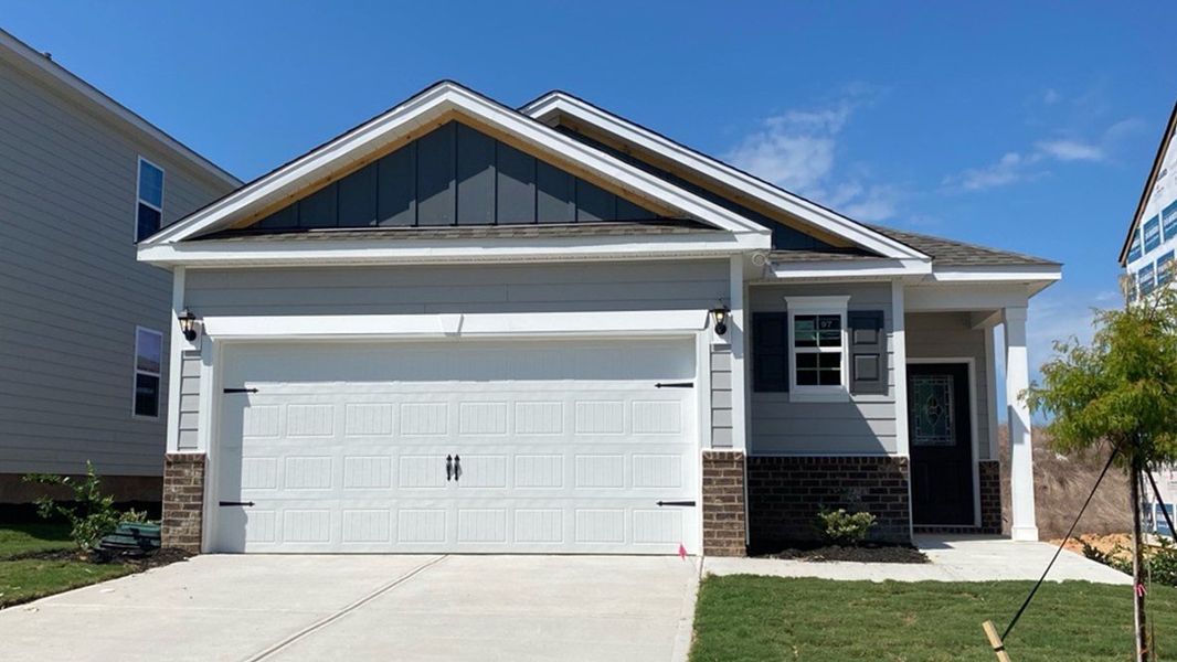 Front exterior of a new home in Livingston Woods, Irmo, SC, highlighting curb appeal (Image 1).