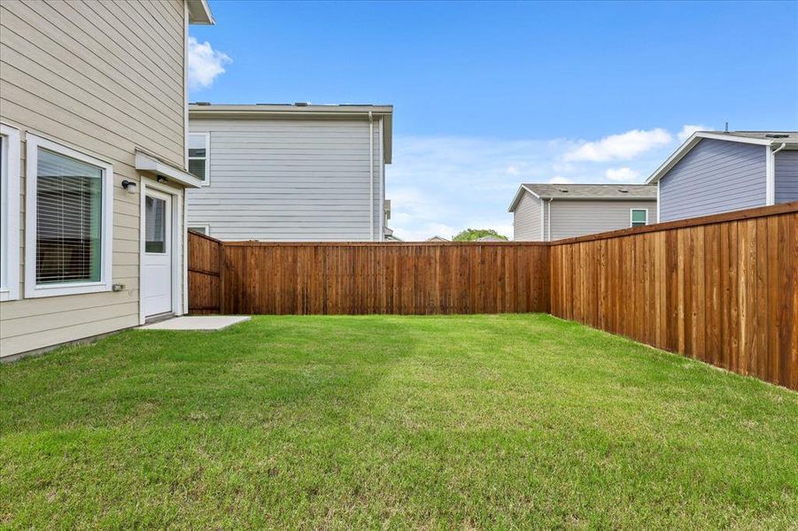 Exterior details and patio area of a home in Foree Ranch: Wellton Collection, Providence Village (Image 23).