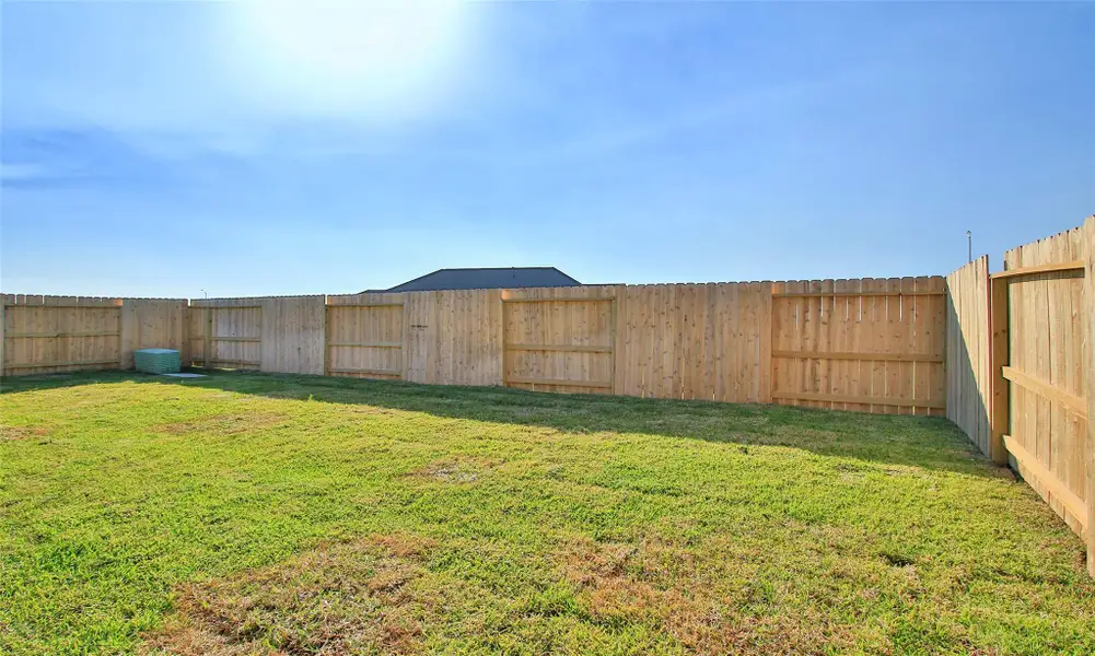 Exterior details and patio area of a home in Sunterra, Katy (Image 3).