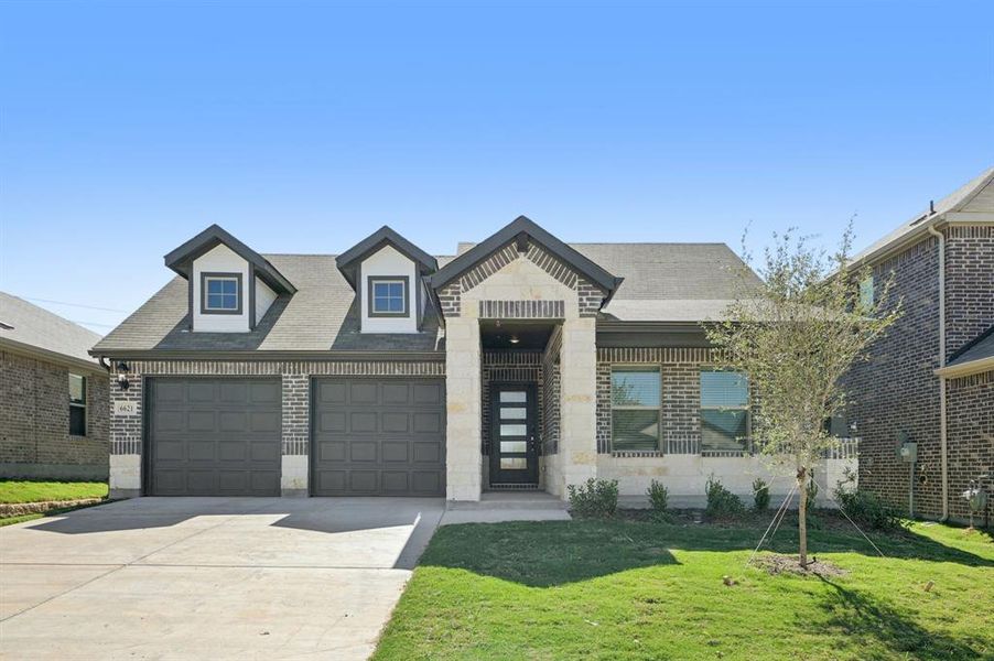 Front exterior of a new home in Tesoro at Chisholm Trail Ranch, Fort Worth, TX, highlighting curb appeal (Image 1). Front exterior of a new home in Tesoro at Chisholm Trail Ranch, Fort Worth, TX, highlighting curb appeal (Image 1).