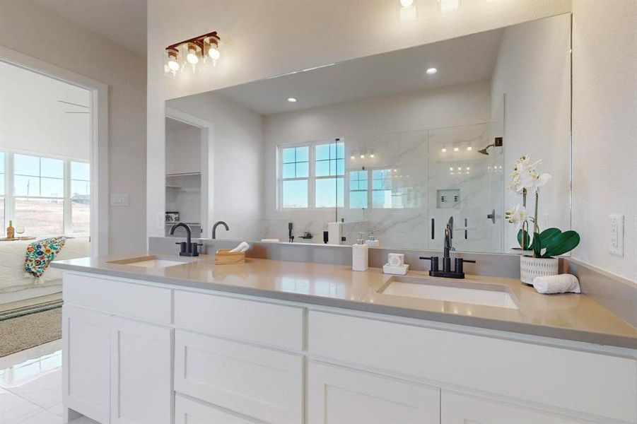 Bathroom with vanity and a shower with shower door