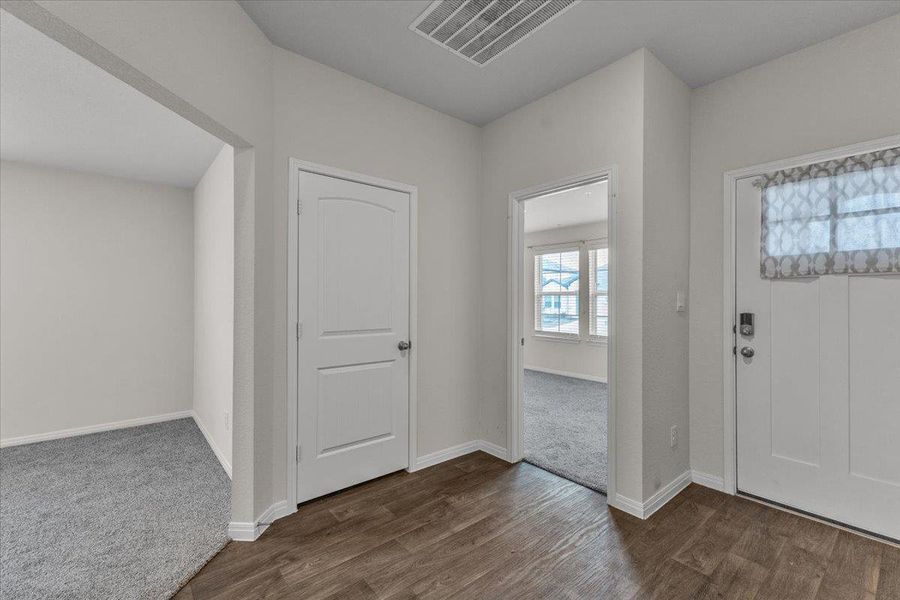 Entryway featuring wood-look flooring and a front door with a decorative window
