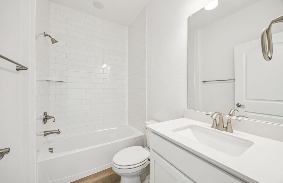Stylish secondary bath with high-end fixtures  *Real home pictured
