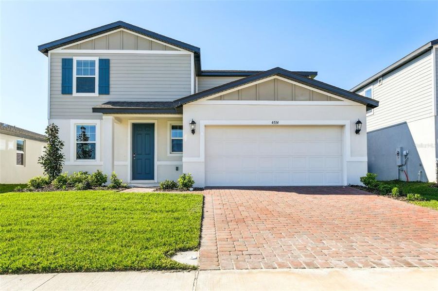Front exterior of a new home in The Meadow at Crossprairie, St. Cloud, FL, highlighting curb appeal (Image 27).