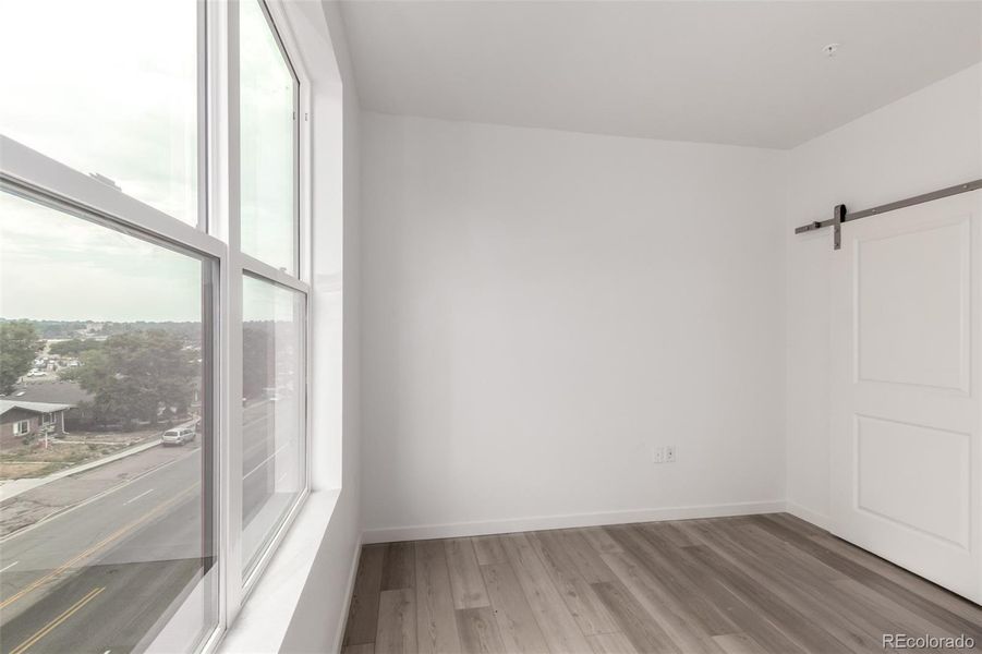 Spacious, unfurnished interior of a new home in The Scene at Sloan's Lake, Denver (Image 9).