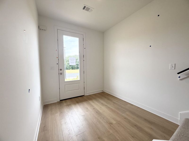 Entrance foyer featuring light wood-type flooring and baseboards Entrance foyer featuring light wood-type flooring and baseboards