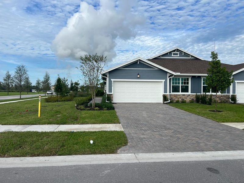 Front exterior of a new home in Arden: The Twin Homes Collection, Loxahatchee, FL, highlighting curb appeal (Image 2).