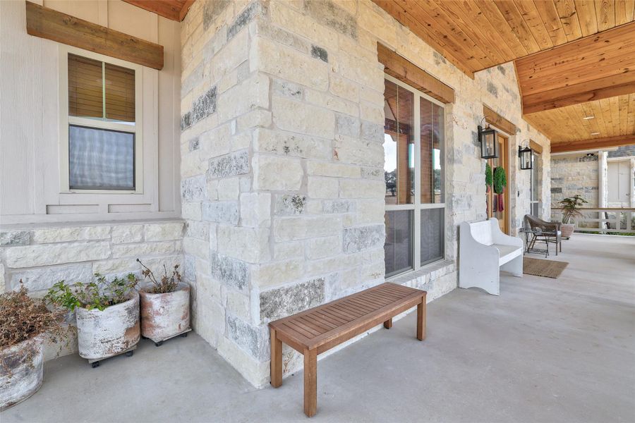 47 ft. wide front porch with custom crafted railings to match Hill Country style of house