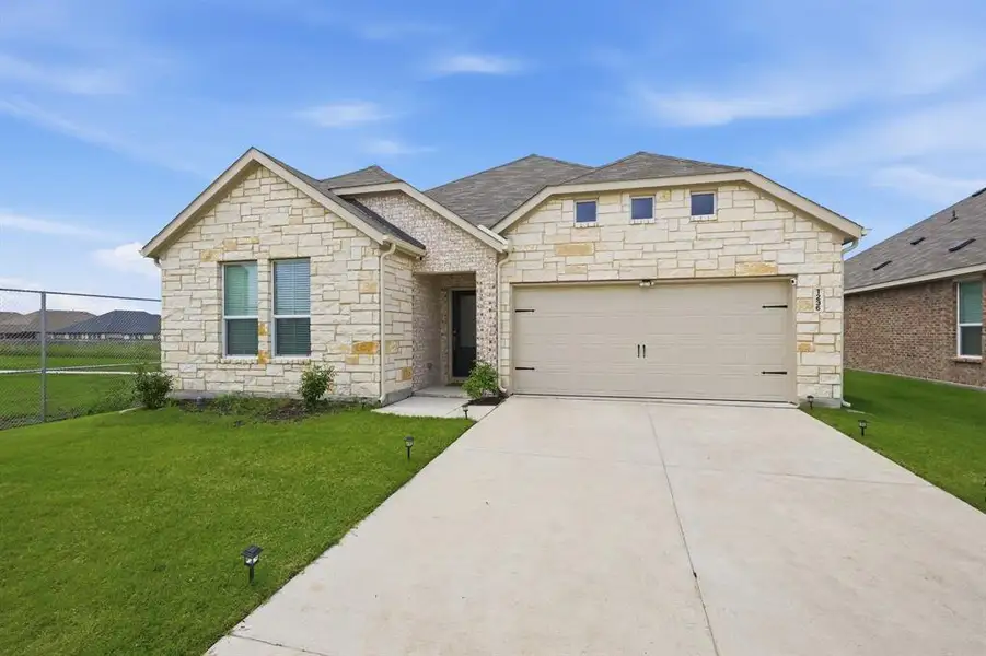 Front exterior of a new home in , Forney, TX, highlighting curb appeal (Image 18).