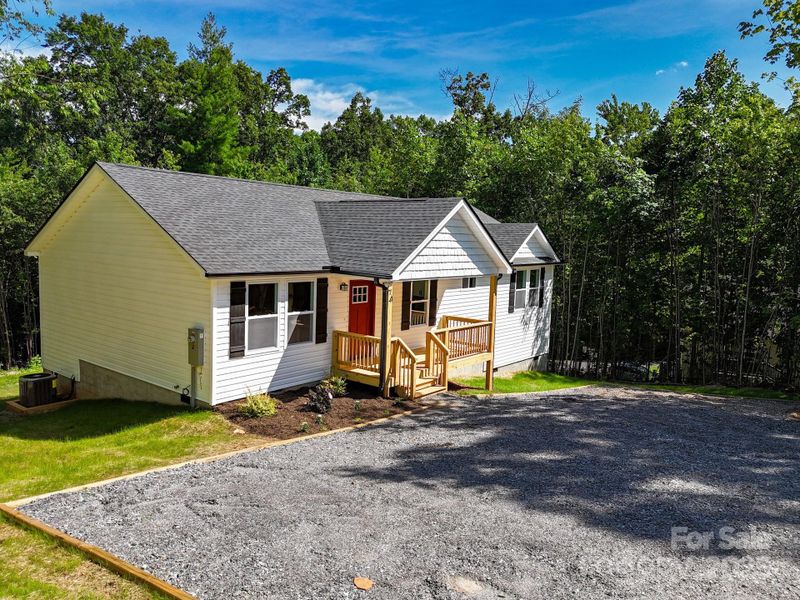 Front exterior of a new home in , Candler, NC, highlighting curb appeal (Image 18). Front exterior of a new home in , Candler, NC, highlighting curb appeal (Image 18).