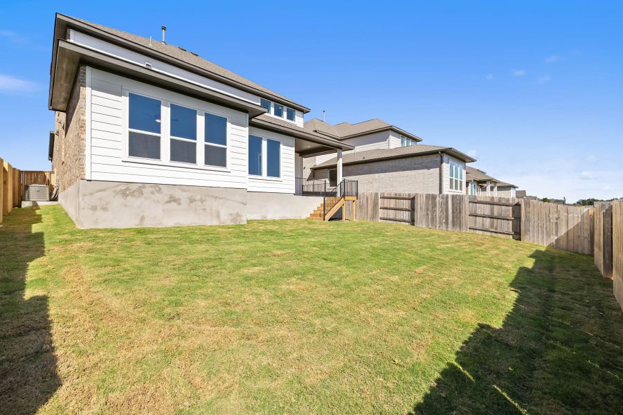 Exterior details and patio area of a home in Lariat, Liberty Hill (Image 29).