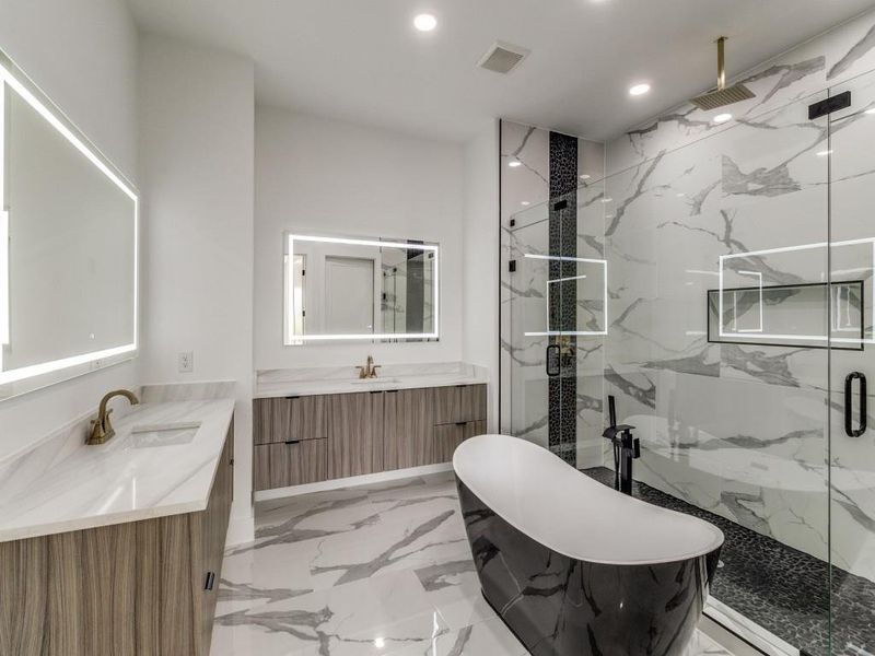 Full bathroom featuring recessed lighting, a marble finish shower, marble finish floors, a soaking tub, and two vanities
