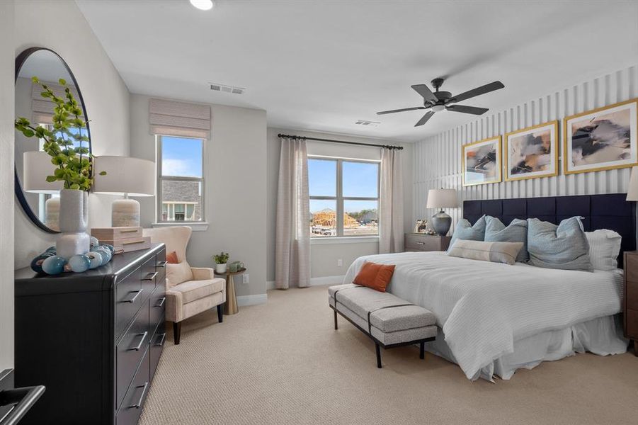 Bedroom with light carpet, a ceiling fan, and wallpapered walls