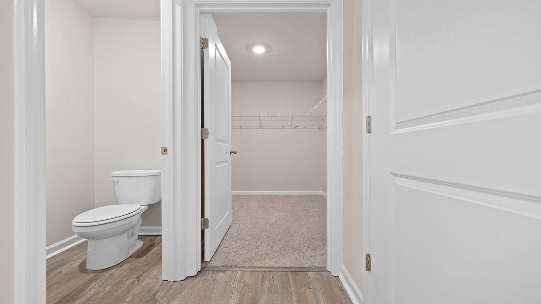 Spacious, unfurnished interior of a new home in Bentley Park, Greenwood (Image 27).