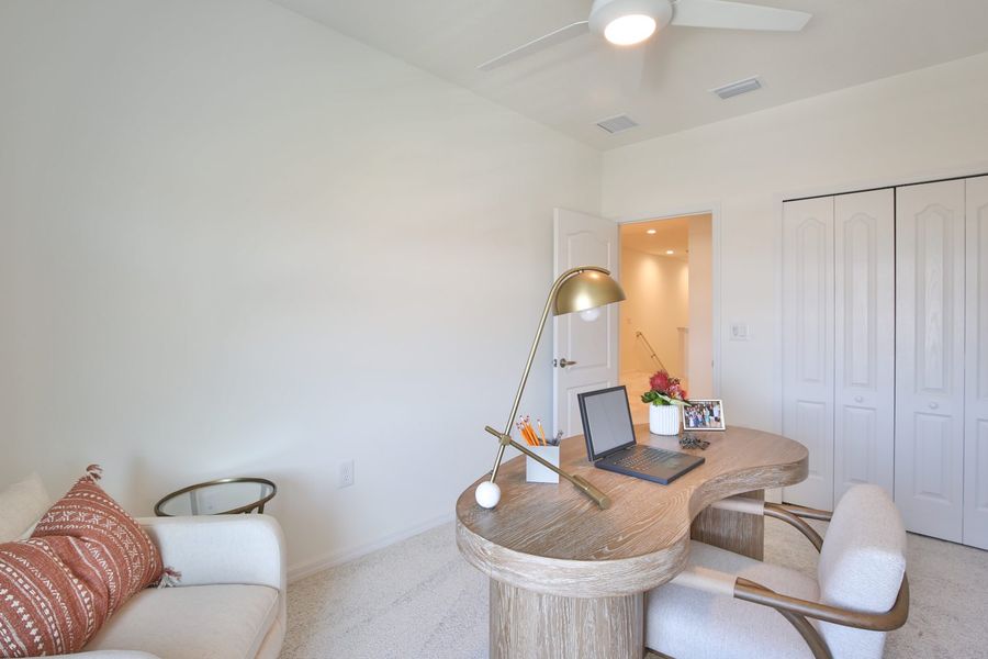 Representative furnished interior of a home built from the Morgan by Neal Communities in SkySail, Naples (Image 9).