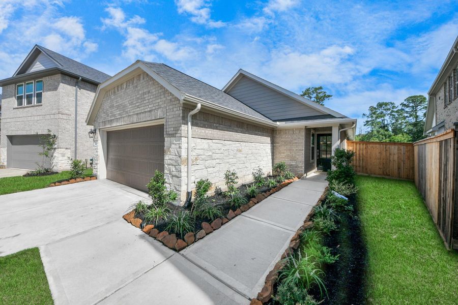 Front exterior of a new home in , Tomball, TX, highlighting curb appeal (Image 18).