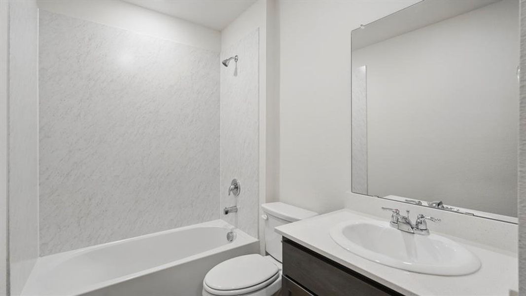 Full bath featuring vanity and tub / shower combination