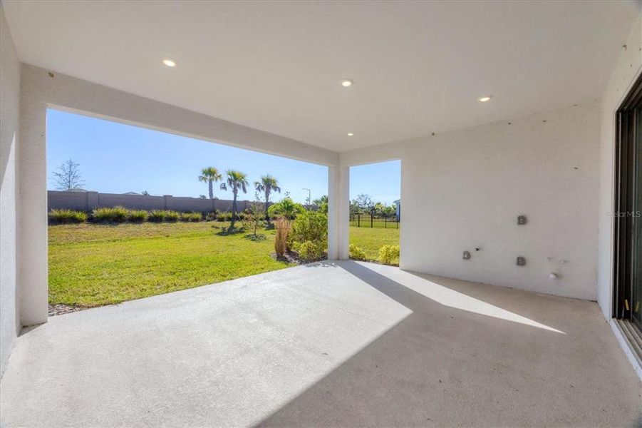 Exterior details and patio area of a home in Esplanade at Artisan Lakes, Palmetto (Image 23).