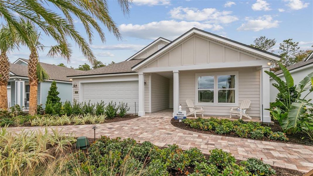 Front exterior of a new home in Sawmill Branch, Palm Coast, FL, highlighting curb appeal (Image 25).