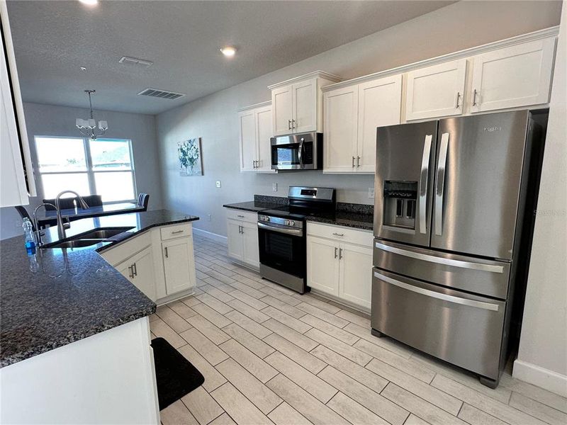 Furnished interior view inside a new home in Abbey Glen, Dade City (Image 6).