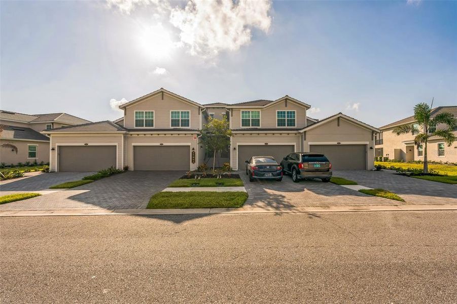 Front exterior of a new home in , Venice, FL, highlighting curb appeal (Image 21).