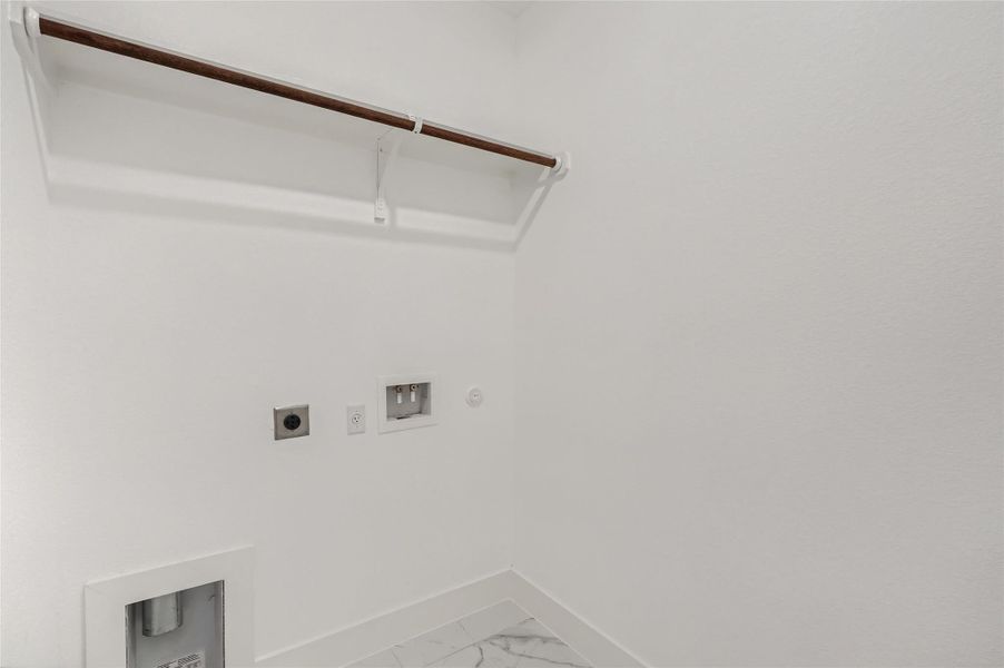 Laundry area featuring electric dryer hookup, washer hookup