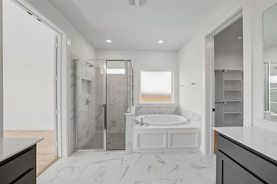Full bath with a marble finish shower, vanity, a bath, light marble finish floors, and recessed lighting