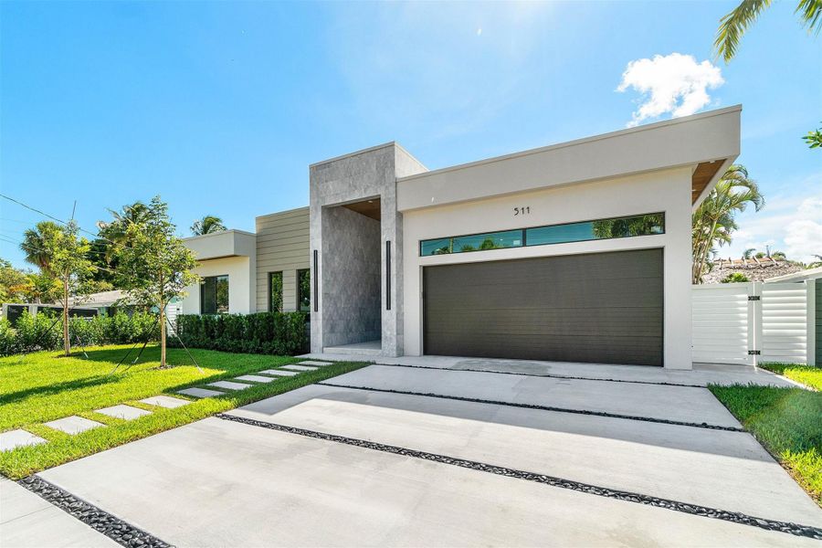 Front exterior of a new home in , Pompano Beach, FL, highlighting curb appeal (Image 22).