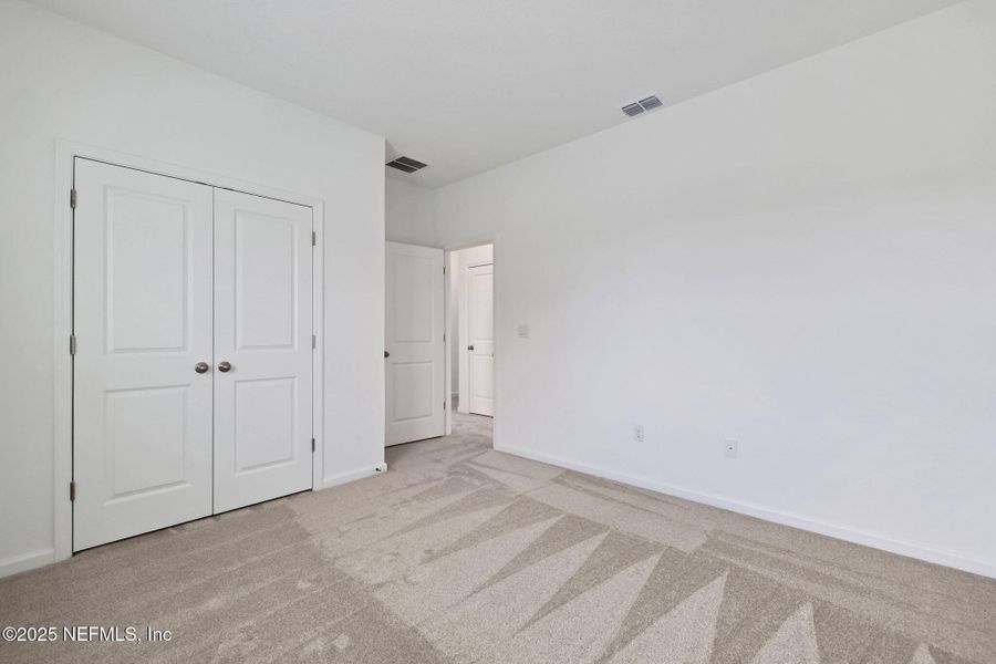 Spacious, unfurnished interior of a new home in TrailMark, St. Augustine (Image 28).