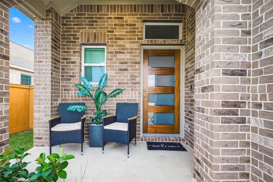 The stylish front porch adds just the right touch of character, creating a sheltered and inviting approach for your guests.