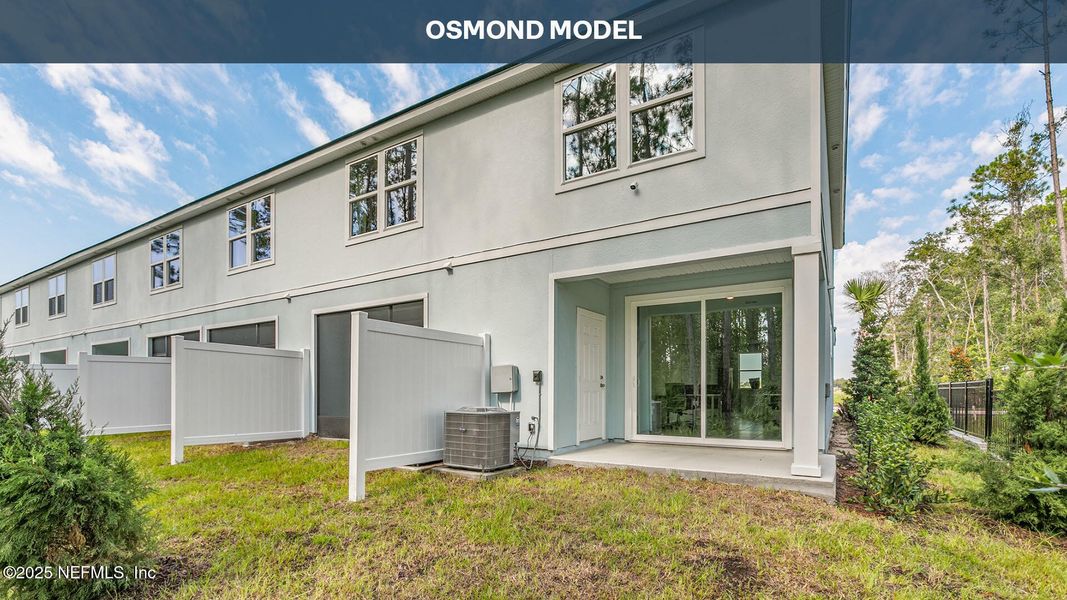 Exterior details and patio area of a home in Cordera Townhomes, St. Augustine (Image 23).