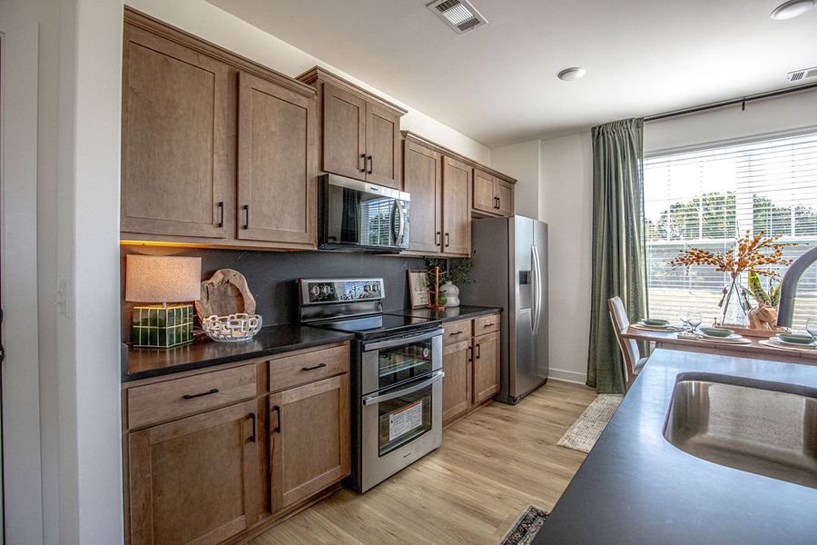 Representative furnished interior of a home built from the Provost by Grant & Co in The Townhomes at Union Depot, Bartlett (Image 10).