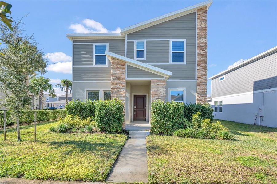 Exterior details and patio area of a home in Rhett's Ridge: Estates Alley Collection, Apopka (Image 4). Exterior details and patio area of a home in Rhett's Ridge: Estates Alley Collection, Apopka (Image 4).