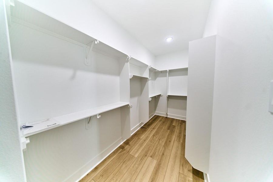 Primary walk-in closet. Primary walk-in closet.