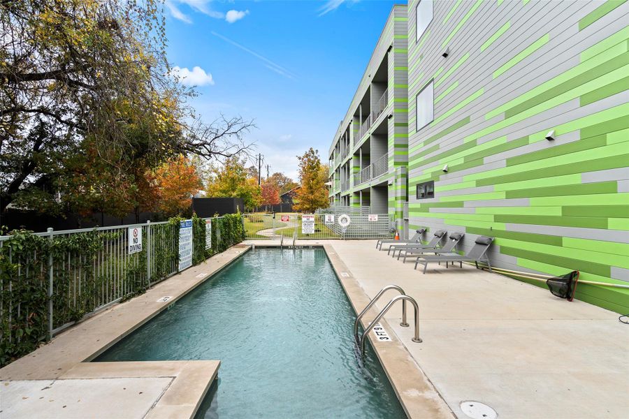 Pool featuring fence and a patio