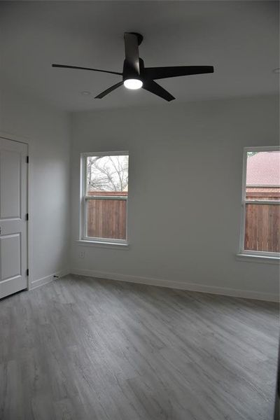 Unfurnished room with a wealth of natural light and light hardwood / wood-style floors