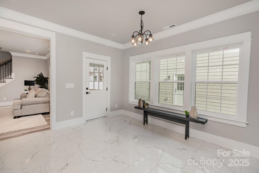 Eating area in kitchen or sitting room leads to covered patio