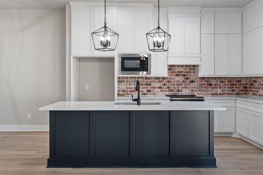 Whitewashed Red Brick Back Splash provide that Modern Farmhouse Feel.