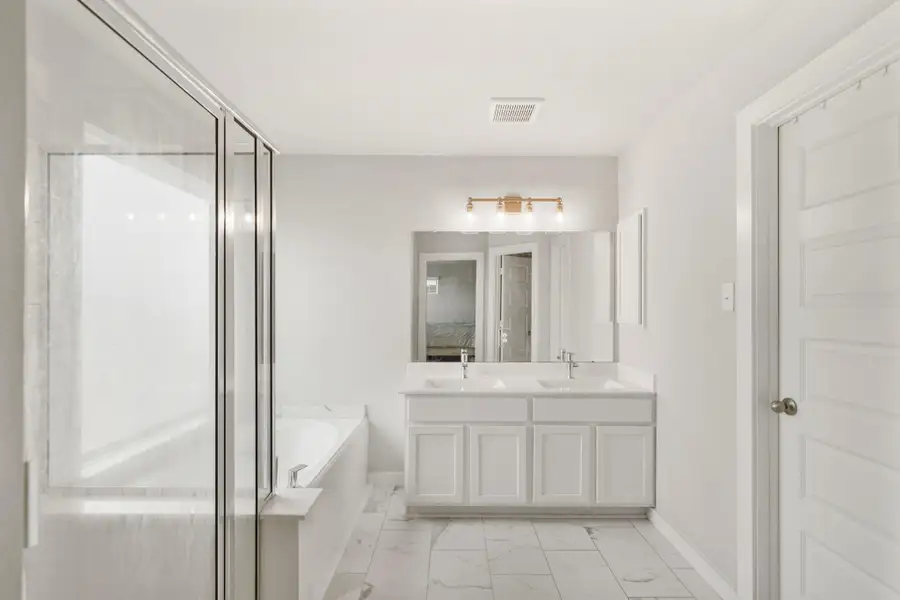 Welcome to your very own retreat! This bathroom boastes gorgeous tile floors, and a spacious walk-in closet.