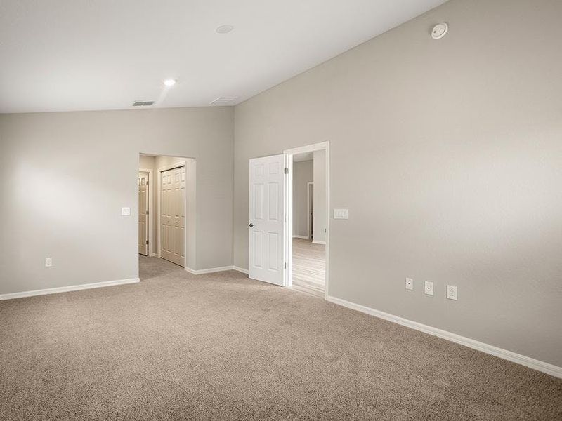 Your spacious 12 ft x 18 ft owner`s suite invites relaxation - Sophia by Highland Homes