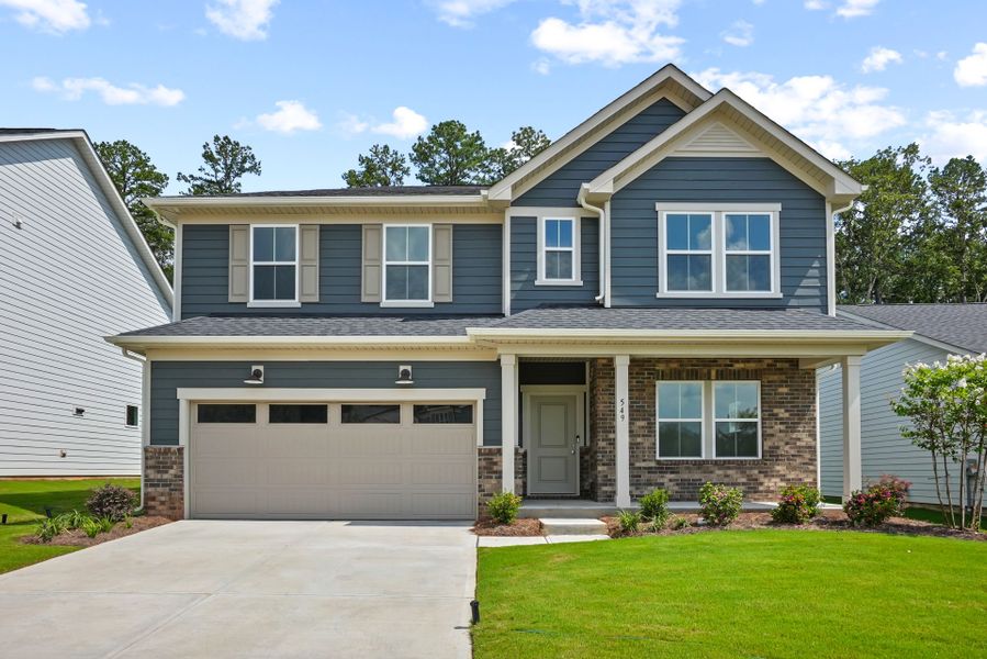 Front exterior of a new home in Michaux Gardens, Belmont, NC, highlighting curb appeal (Image 27). Front exterior of a new home in Michaux Gardens, Belmont, NC, highlighting curb appeal (Image 27).