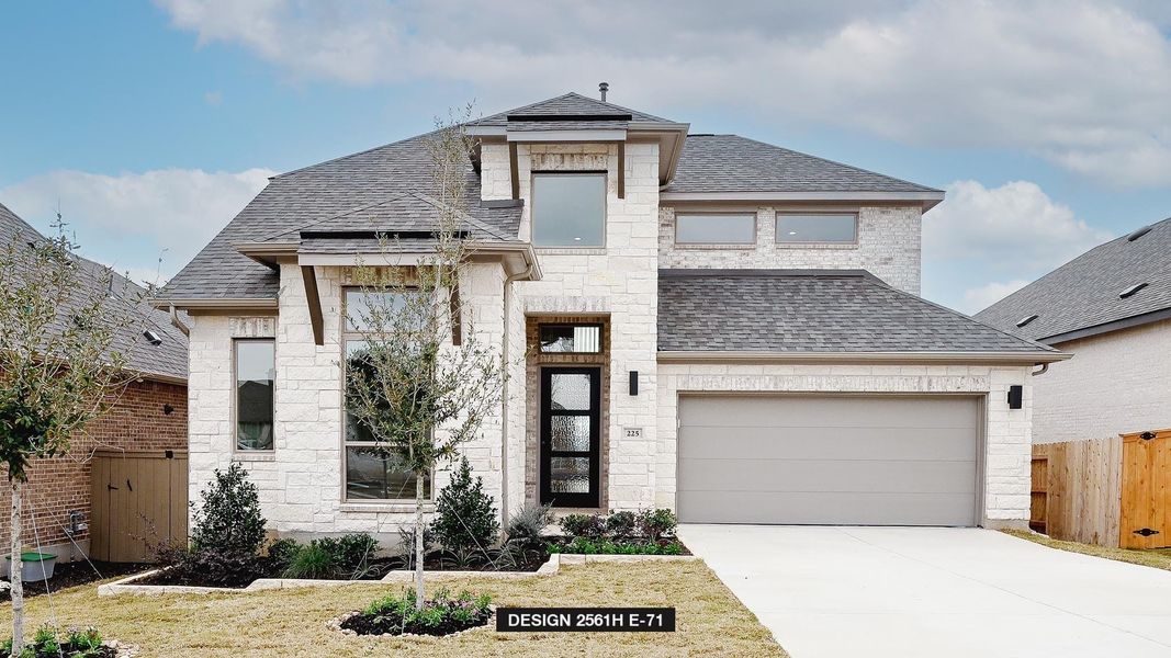 View of front of property featuring a garage