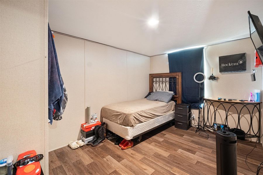 Bedroom with wood finished floors