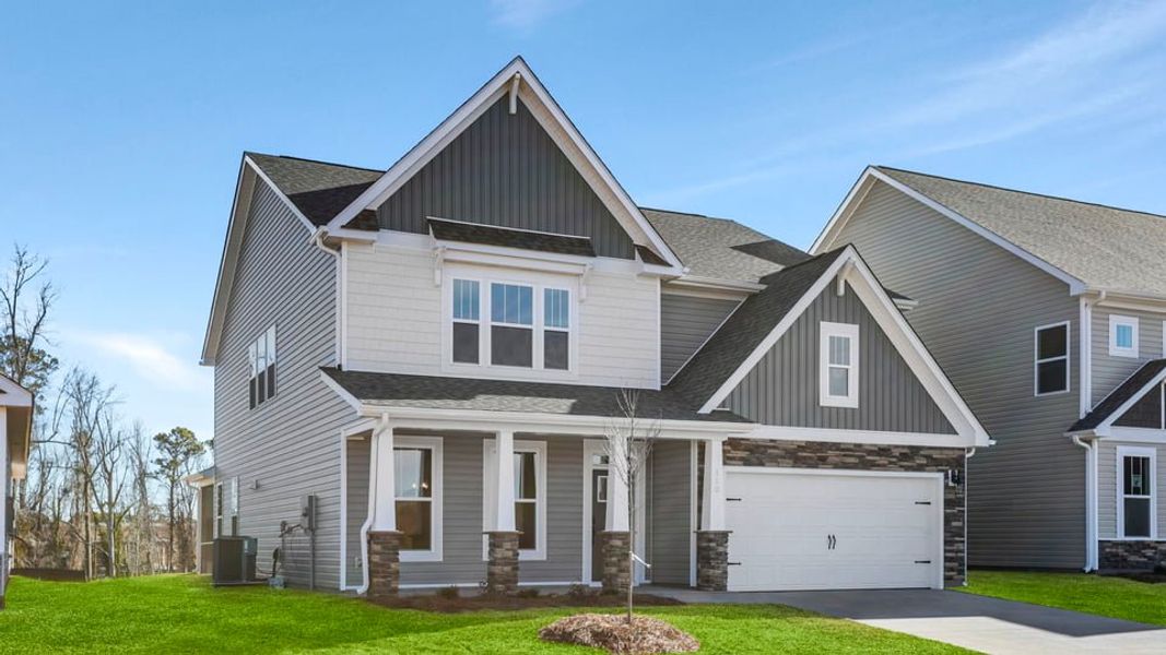 Front exterior of a new home in Seven Oaks, Greenwood, SC, highlighting curb appeal (Image 2). Front exterior of a new home in Seven Oaks, Greenwood, SC, highlighting curb appeal (Image 2).