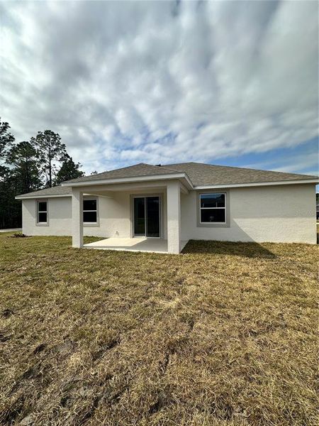 Exterior details and patio area of a home in Palm Coast: Cornerstone Collection, Palm Coast (Image 2).