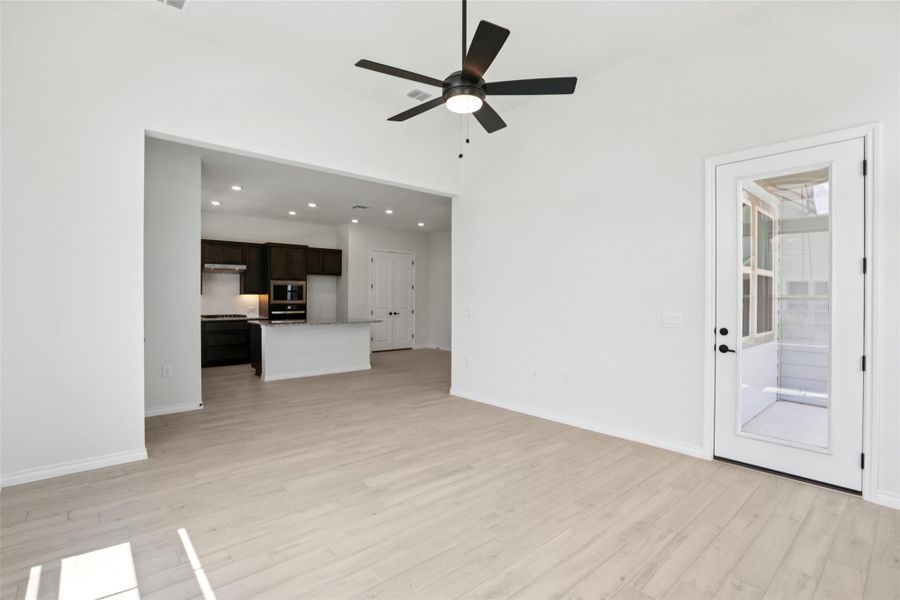 Unfurnished living room featuring recessed lighting, light wood-type flooring, and a ceiling fan