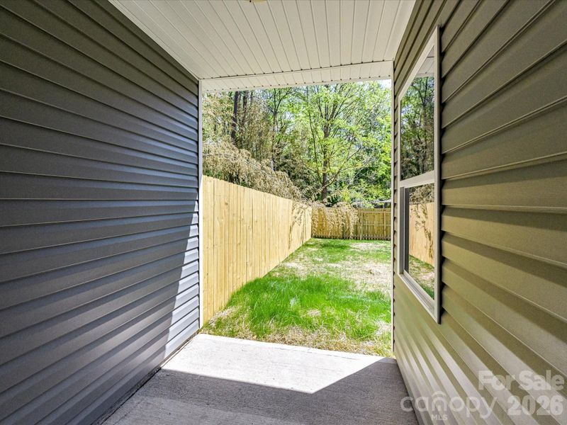 Covered patio offering a private outdoor retreat with easy access to a fenced backyard, perfect for relaxing or entertaining. Covered patio offering a private outdoor retreat with easy access to a fenced backyard, perfect for relaxing or entertaining.